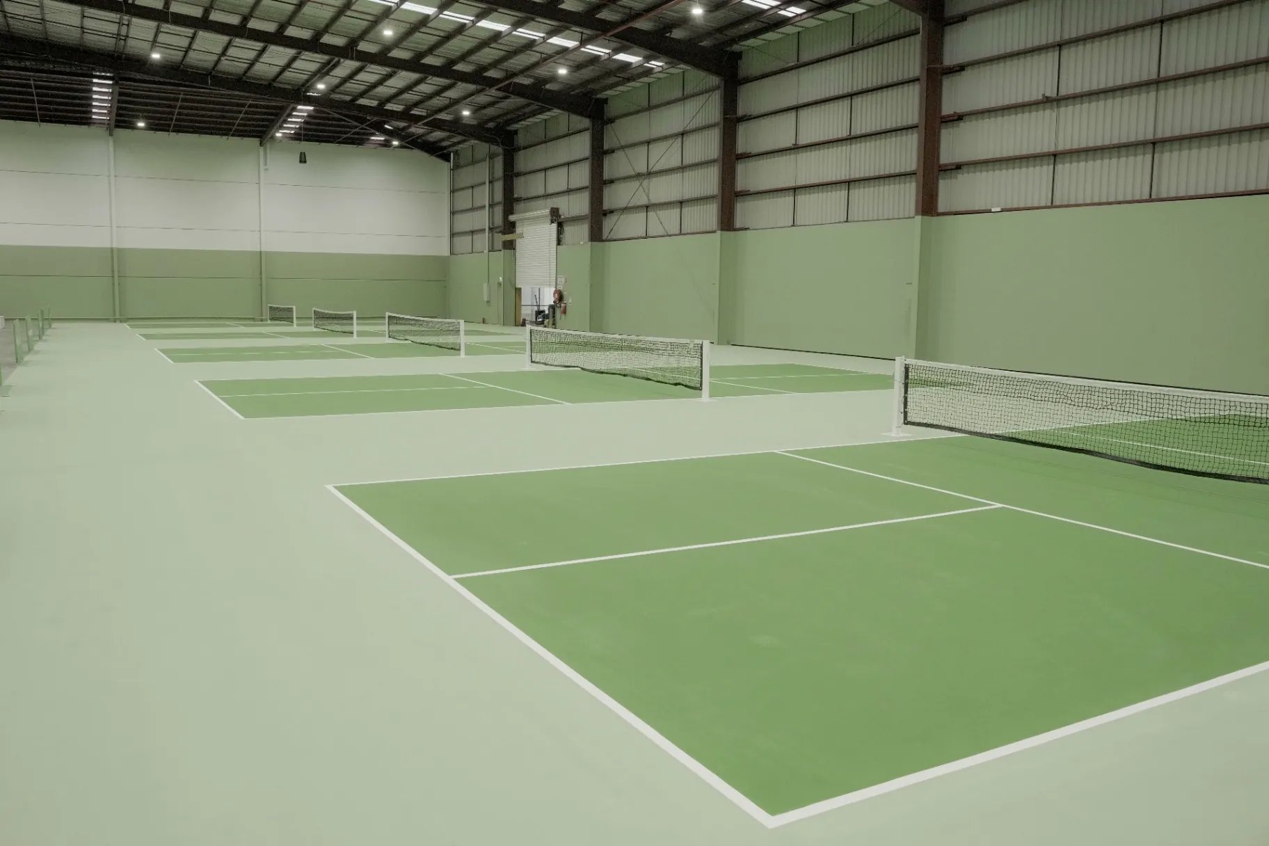 The Jar Club — indoor racquet courts in morning light